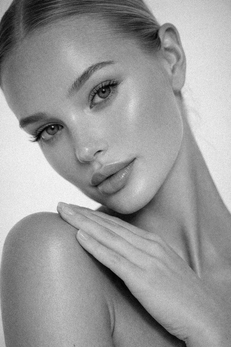 Black and white editorial portrait of clear, healthy skin