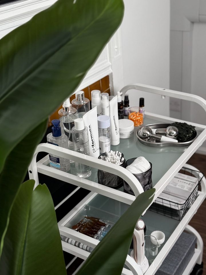 A trolley of professional skincare products used during treatments at the studio.